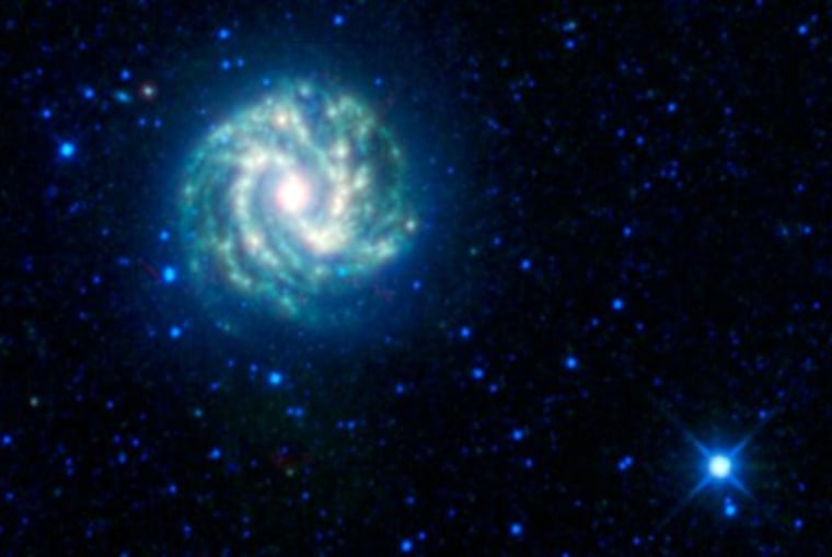 This image provided by the NASA/JPL-Caltech/WISE Team shows the Wide-field Infrared Survey Explorer (WISE) view of the nearby galaxy Messier 83. It is sometimes referred to as the southern Pinwheel galaxy. What's special about WISE is its ability to see through impenetrable veils of dust, picking up the heat glow of objects that are invisible to regular telescopes. So far, WISE has discovered 25,000 never-before-seen asteroids. Of those, 95 are considered \"near-Earth\" asteroids.(AP Photo/ NASA/JPL-Caltech/WISE Team)